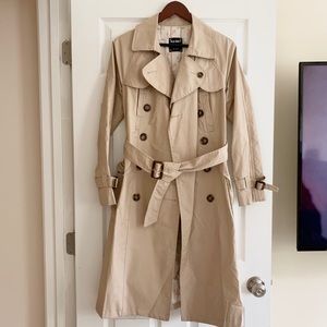 Tan trench coat with tortoise buttons